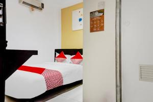 Posteľ alebo postele v izbe v ubytovaní Super OYO 90692 Point Hostel