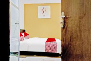 Posteľ alebo postele v izbe v ubytovaní Super OYO 90692 Point Hostel