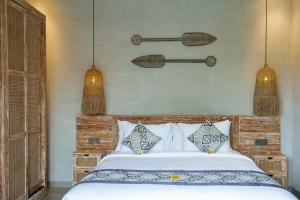 Letto o letti in una camera di The Macaw Ubud Green Uma Villa
