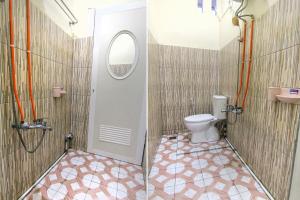 Ein Badezimmer in der Unterkunft OYO 3334 Ratu Residence