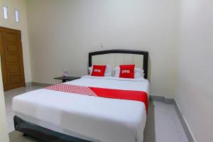 Ein Bett oder Betten in einem Zimmer der Unterkunft OYO 3334 Ratu Residence