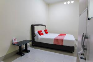 Ein Bett oder Betten in einem Zimmer der Unterkunft OYO 3334 Ratu Residence