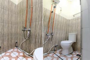 Ein Badezimmer in der Unterkunft OYO 3334 Ratu Residence