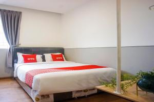 Postel nebo postele na pokoji v ubytování SUPER OYO 93064 Alhesa Residence