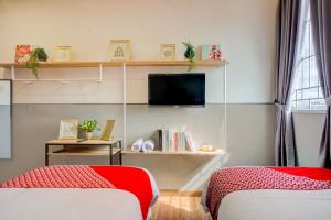 TV a/nebo společenská místnost v ubytování SUPER OYO 93064 Alhesa Residence