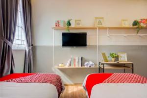 Postel nebo postele na pokoji v ubytování SUPER OYO 93064 Alhesa Residence + 37 fotografií