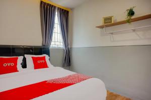 Postel nebo postele na pokoji v ubytování SUPER OYO 93064 Alhesa Residence
