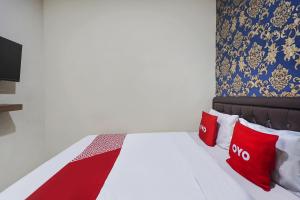 Voodi või voodid majutusasutuse OYO D'lima Guest House Sub toas