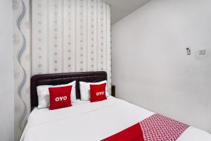Voodi või voodid majutusasutuse OYO D'lima Guest House Sub toas