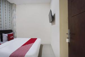Voodi või voodid majutusasutuse OYO D'lima Guest House Sub toas
