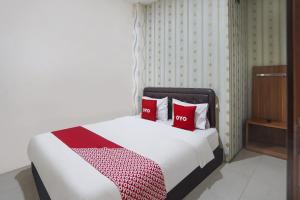 Voodi või voodid majutusasutuse OYO D'lima Guest House Sub toas
