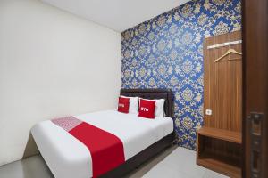 Voodi või voodid majutusasutuse OYO D'lima Guest House Sub toas