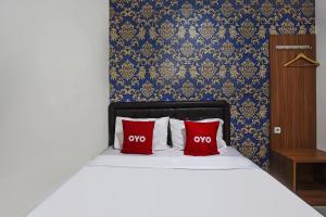 Voodi või voodid majutusasutuse OYO D'lima Guest House Sub toas