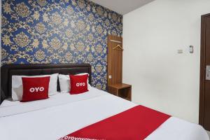 Voodi või voodid majutusasutuse OYO D'lima Guest House Sub toas
