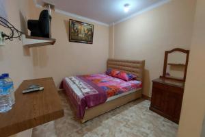 Postel nebo postele na pokoji v ubytování Hotel O Rasya Homestay Near SD Negeri 6 Mataram
