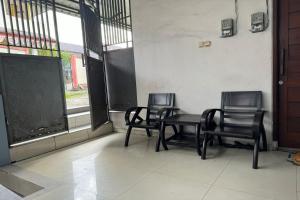 Μια τηλεόραση ή/και κέντρο ψυχαγωγίας στο Hotel O Widan Homestay