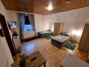 TV a/nebo společenská místnost v ubytování Haus Ruhrpott