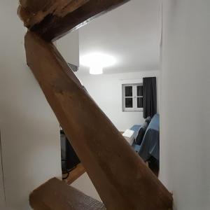 a stairway leading to a room with a table at Chiado Carmo Sunny Lodge in Lisbon