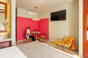 TV a/nebo společenská místnost v ubytování Hotel Poquito a Poquito