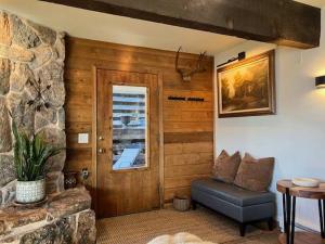 a living room with a couch and a window at Aspen Chalet 976 in Aspen