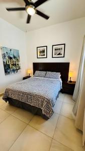 a bedroom with a bed and a ceiling fan at Ajijic 1 Bedroom Guesthouse -Walk To Everything -Patio -Bikes - Pickleball Court in Ajijic