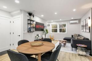 a living room with a table and chairs at Modern Ballard Retreat Near Beach & Parks in Seattle