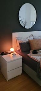 A bed or beds in a room at Apartman Riva
