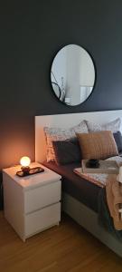 A bed or beds in a room at Apartman Riva