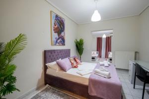 Ένα ή περισσότερα κρεβάτια σε δωμάτιο στο Infinity Apartment