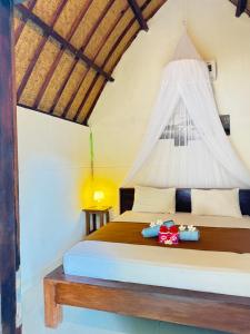 Postel nebo postele na pokoji v ubytování KABY Bungalows