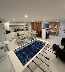 a living room with a pool in the middle of a kitchen at Best Gerês village in São Pedro