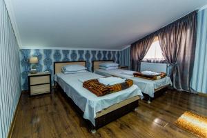 Letto o letti in una camera di HOTEL GUGLUX &WINE CELLAR