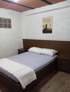 Postel nebo postele na pokoji v ubytování Hostal otro cuento