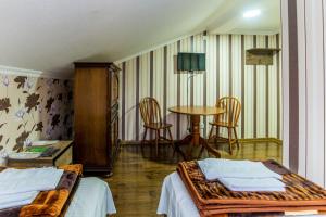 Letto o letti in una camera di HOTEL GUGLUX &WINE CELLAR
