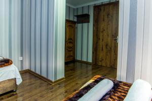 Letto o letti in una camera di HOTEL GUGLUX &WINE CELLAR