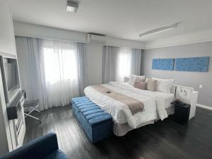 Rúm í herbergi á Flat Hotel Moema Ibirapuera