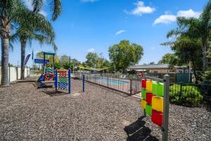 a playground at a park with a pool at Albury Holiday Park in Albury +39 photos
