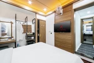 Postel nebo postele na pokoji v ubytování A25 Hotel - 21 Nghia Tan