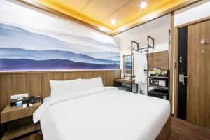 Postel nebo postele na pokoji v ubytování A25 Hotel - 21 Nghia Tan