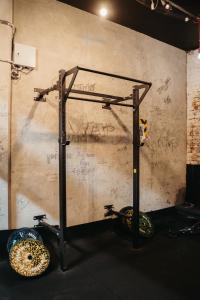 a gym with a wall with graffiti on it at Auckland Boutique Capsule in Auckland +11 photos