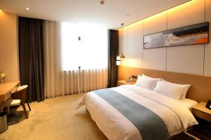 Postelja oz. postelje v sobi nastanitve Kaixiang Yilan Hotel