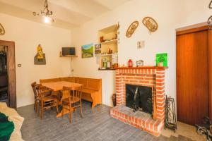a living room with a table and a fireplace at Casa vacanze da Medardo in Gagliano Aterno