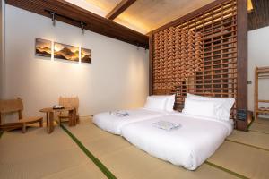 Ένα ή περισσότερα κρεβάτια σε δωμάτιο στο Hoshi Hotel Hatyai +15 φωτογραφίες