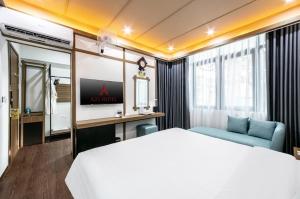 Postel nebo postele na pokoji v ubytování A25 Hotel - 21 Nghia Tan