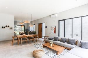 a living room with a couch and a table at The Banyu House 3 in Bandung