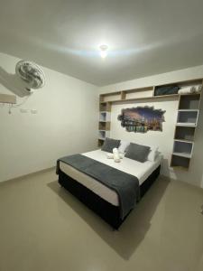 a bedroom with a large bed in a room at ApartaSol san Jerónimo in San Jerónimo