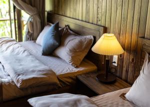 Postel nebo postele na pokoji v ubytování KỲ VIÊN Home & Cafe