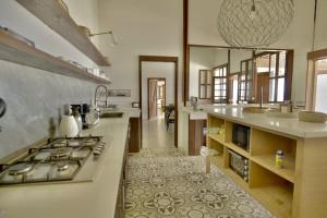 a kitchen with a stove and a counter top at Villa Lukner Las Terrenas in Las Terrenas