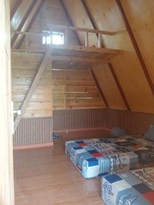 a room with two beds in a attic at Arthuro homestay in Si Antar