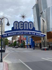 a large sign for the largest little city in the world at Premier Stay Near Casinos with King Beds & Entertainment in Reno